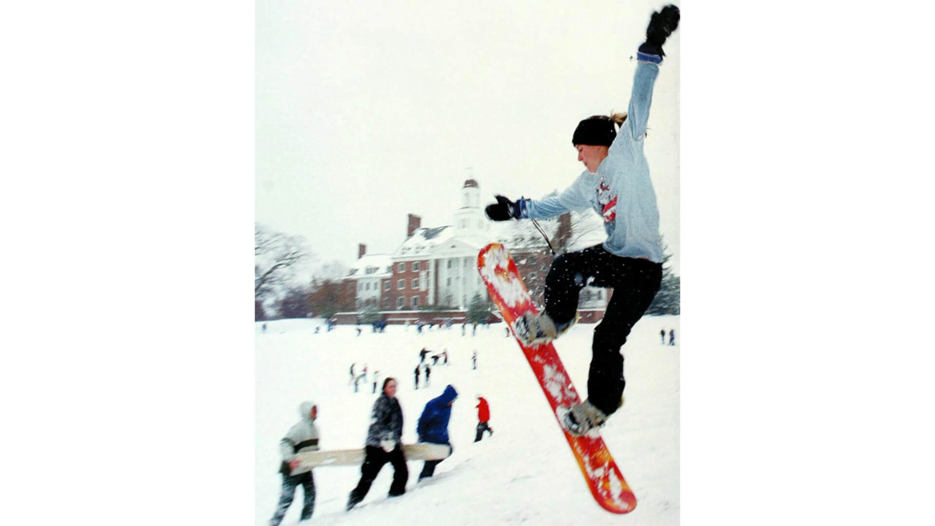 Student snowboarding on campus in 2003