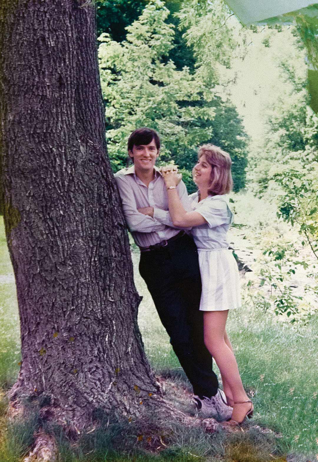 Andrea Chamblee and John McNamara lean against a tree