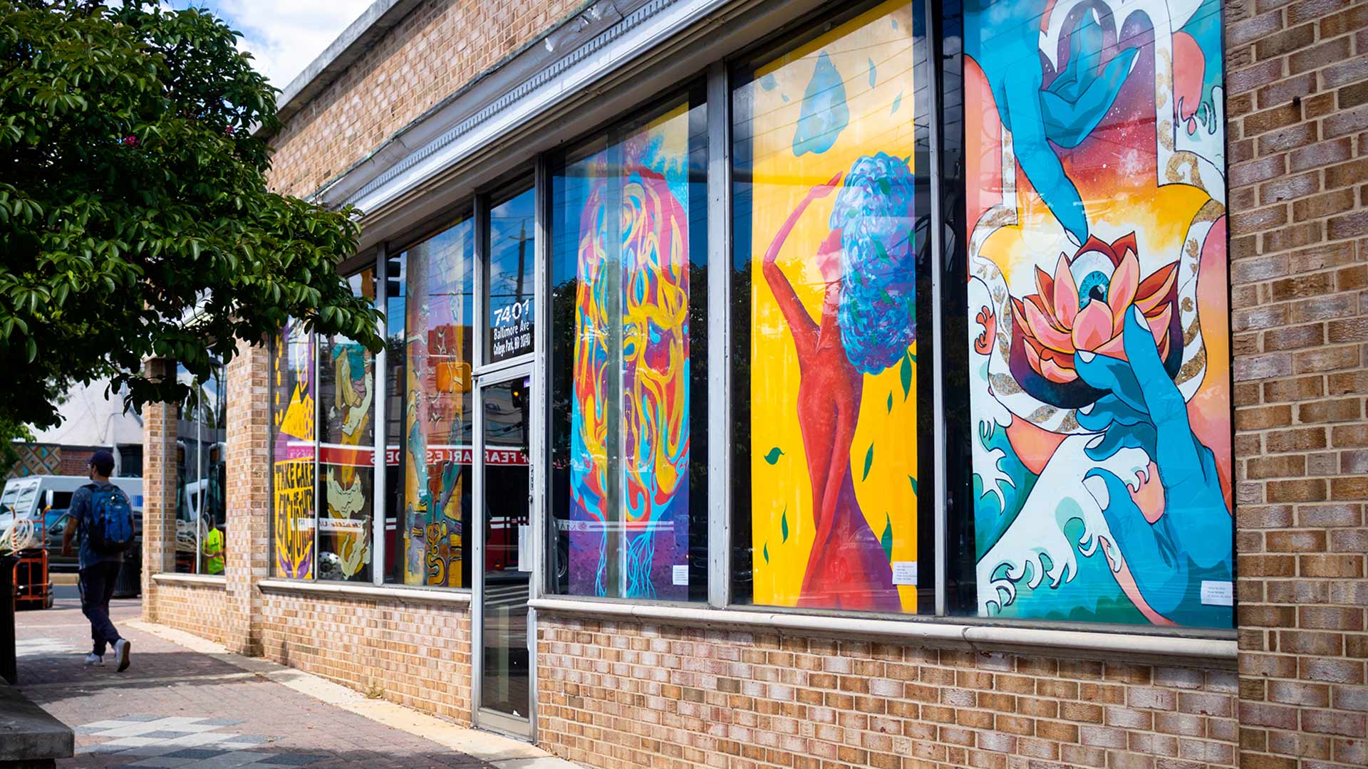 Murals in windows along Baltimore Avenue