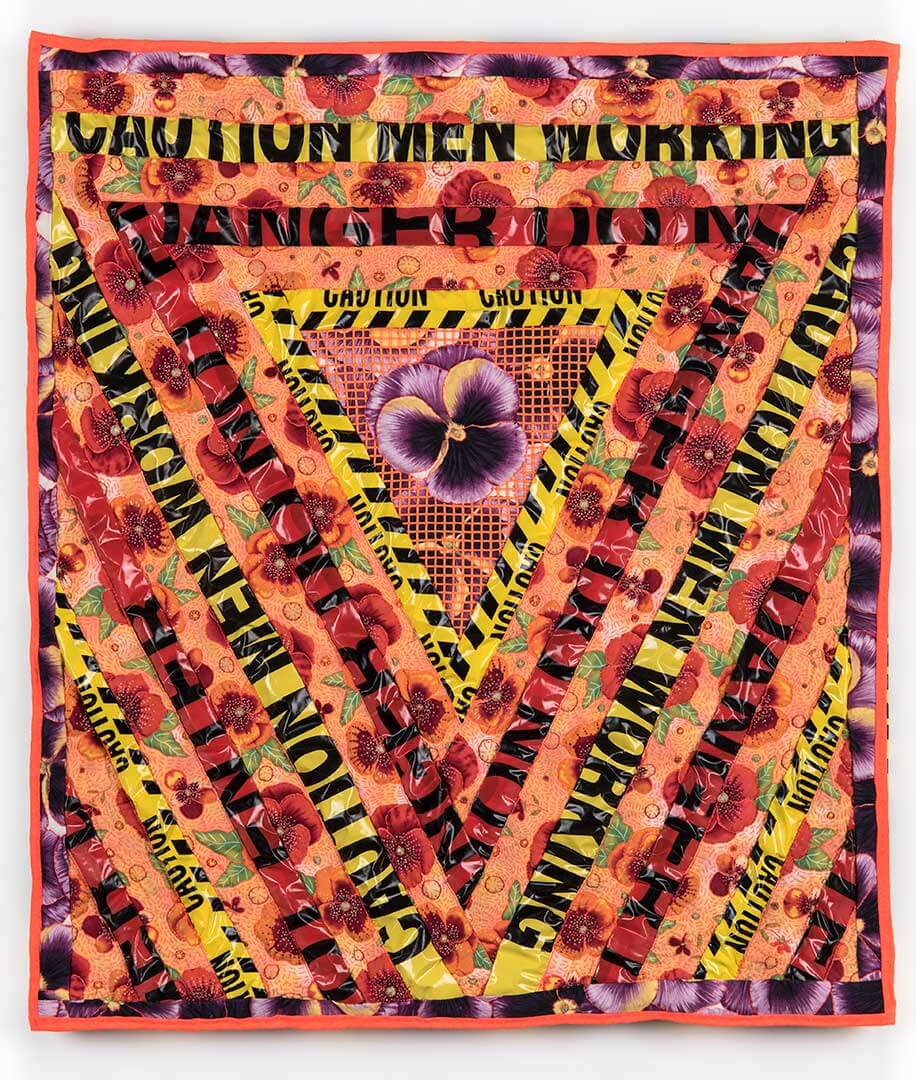 “Pansies and Tulips,” machine-sewn top, hand-quilted cotton pansy fabric, appropriated inkjet photo printed on fabric, found 3 mil poly caution tape, thread