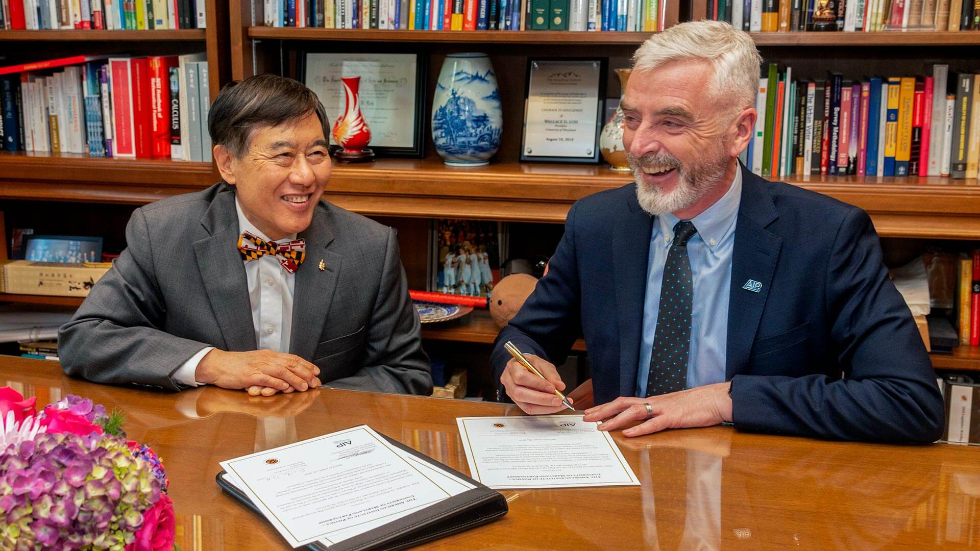 President Wallace D. Loh and Michael H. Moloney, chief executive officer at AIP