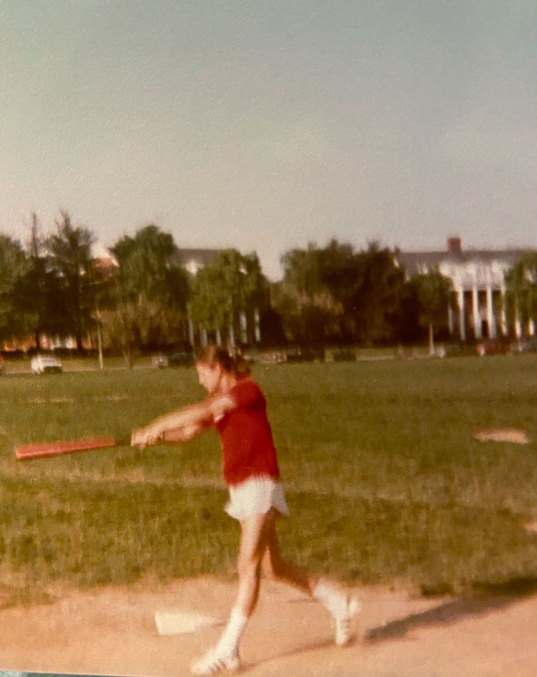Dr. Kathleen Neuzil ’83 playing club softball at UMD