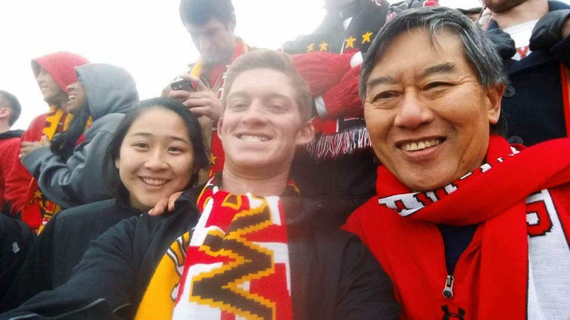 Sadie Lynch, Daniel Callow and President Loh at a UMD soccer game