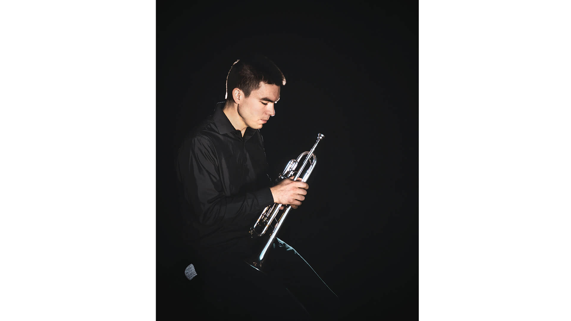 Student holds trumpet